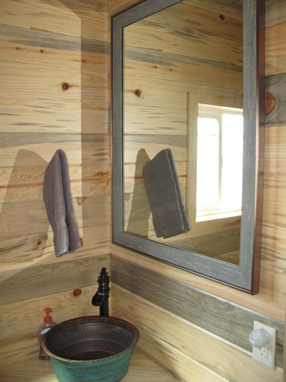 Bathroom with copper vessel sink.