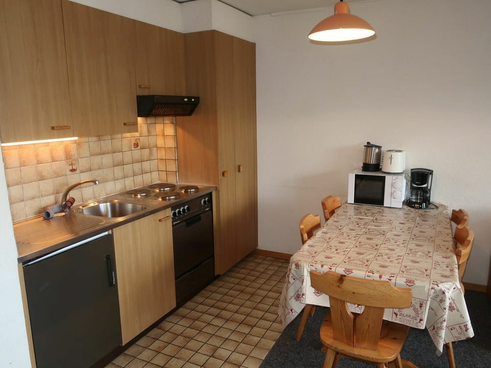 Furniture, Kitchen Sink, Cabinetry, Sink, Tap, Countertop, Table, Wood, Plumbing Fixture, Kitchen Stove