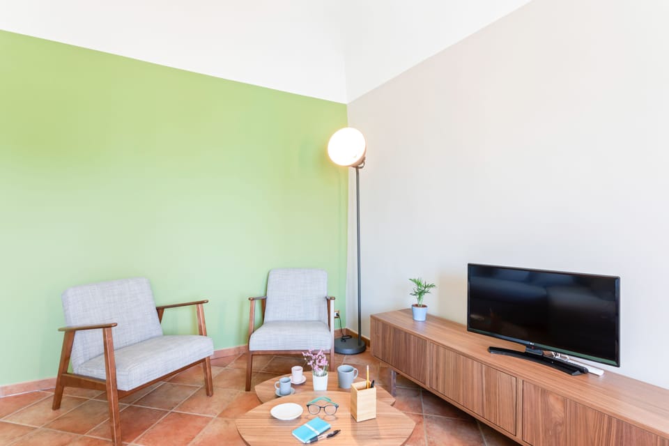 Apartment, 1 Bedroom | Living area | Flat-screen TV