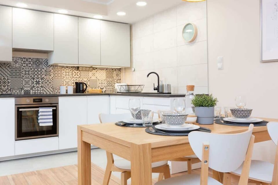 The sleek design of the kitchenette blending seamlessly with the living area.