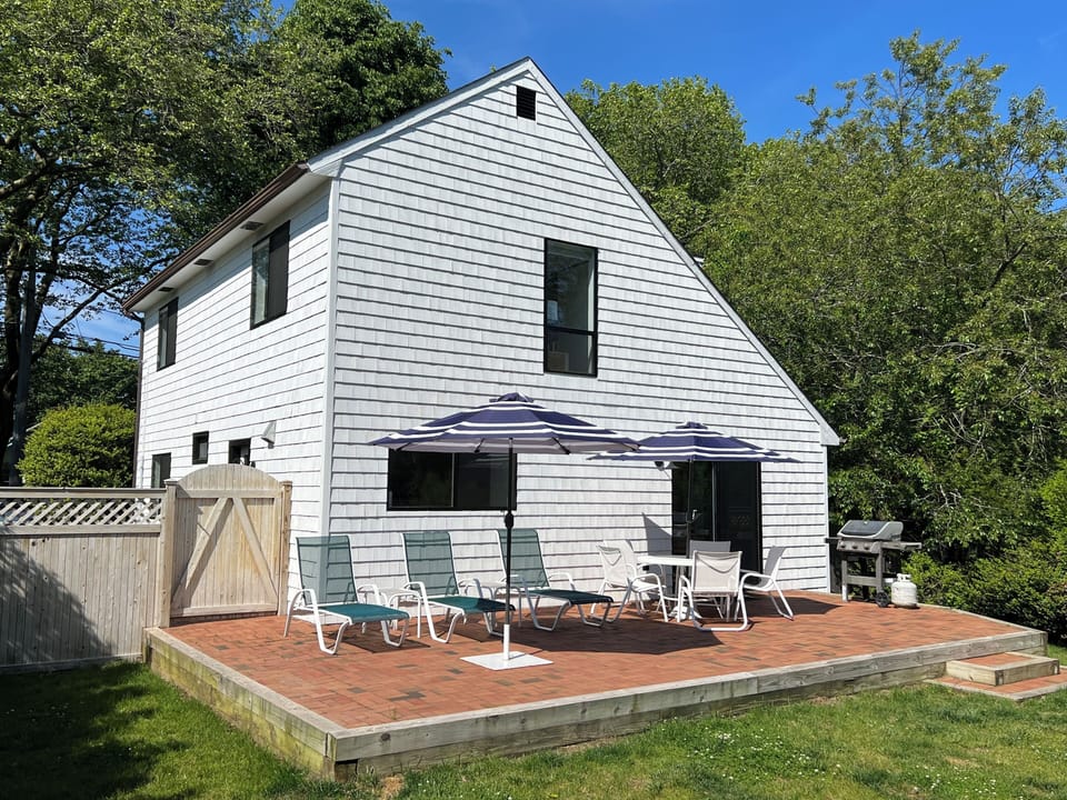 Relax in the sun or under the umbrella on the lovely brick patio