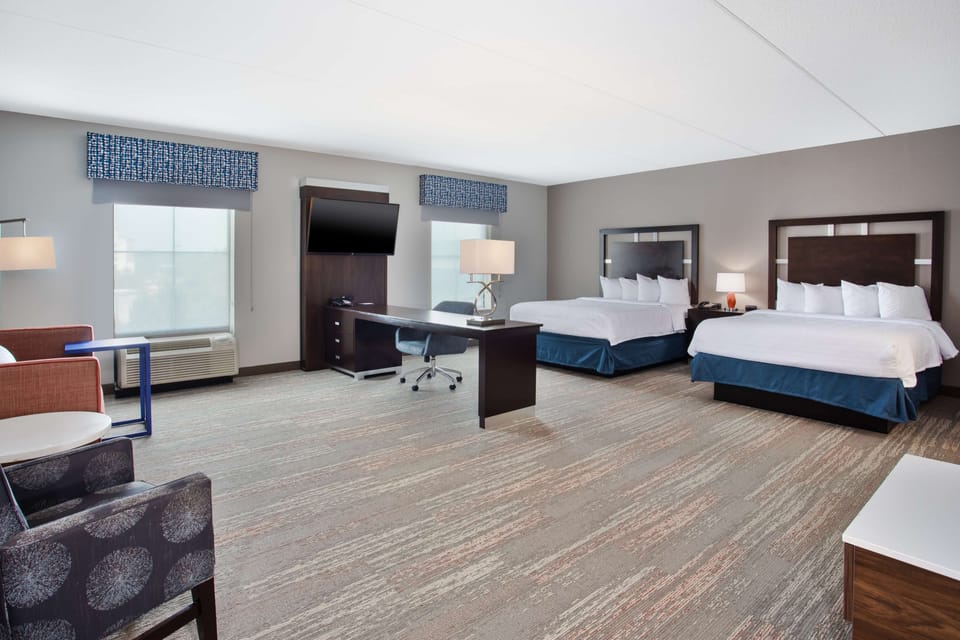 Premium bedding, pillowtop beds, desk, blackout drapes