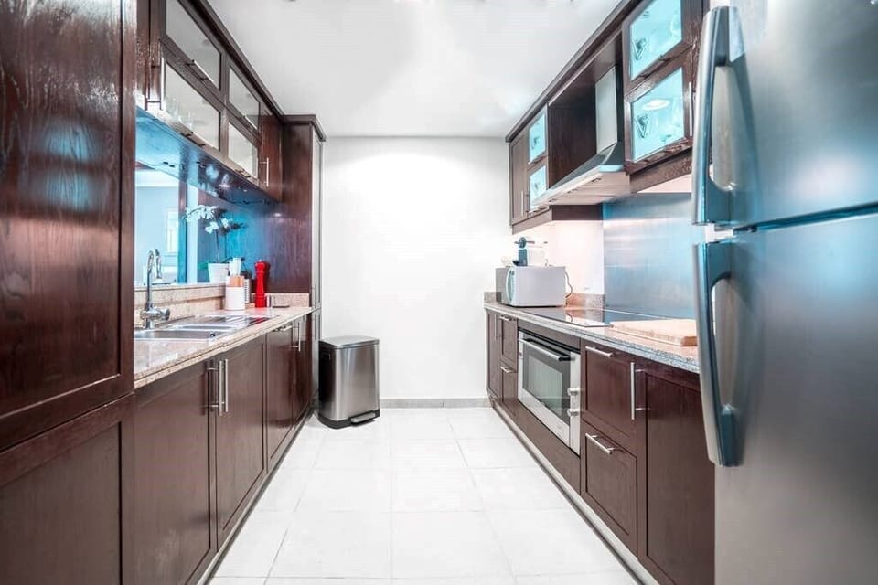 Exclusive Apartment | Private kitchen | Full-size fridge, microwave, oven, stovetop