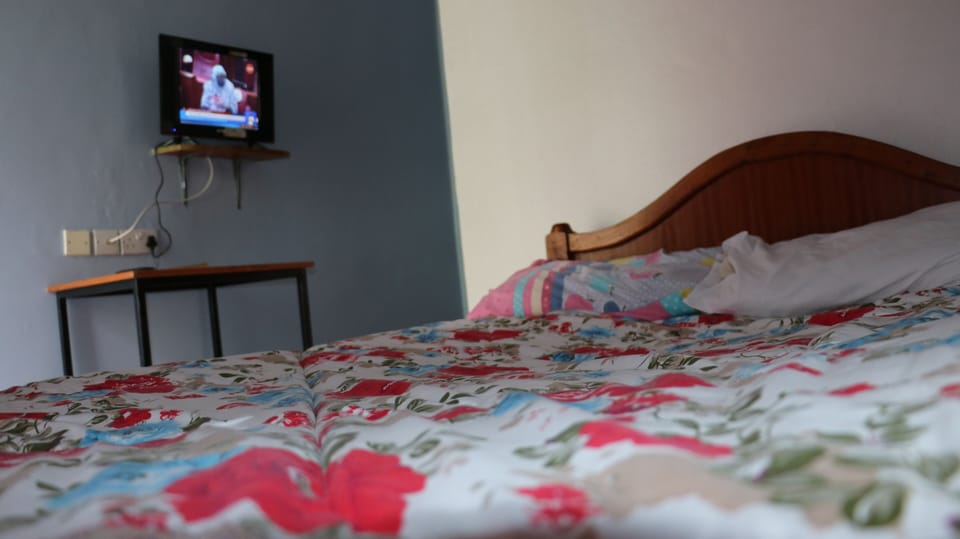 Desk, laptop workspace, bed sheets