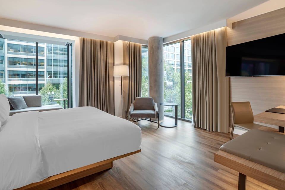 Premium bedding, desk, laptop workspace, iron/ironing board