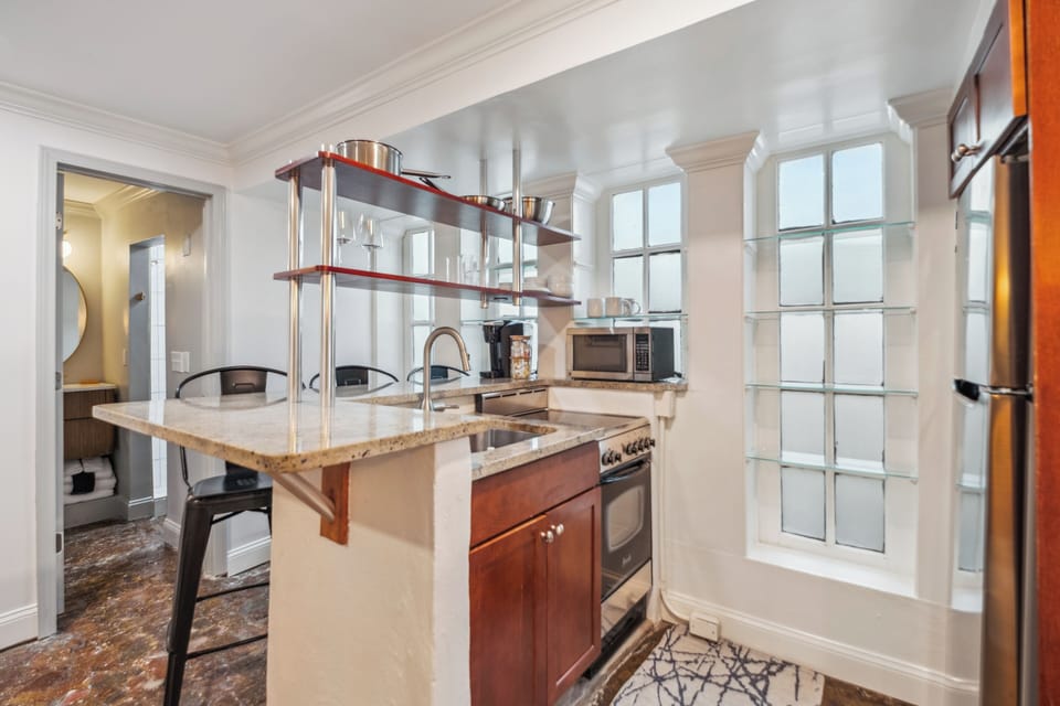 Apartment D | Private kitchenette | Full-size fridge, microwave, stovetop, coffee/tea maker