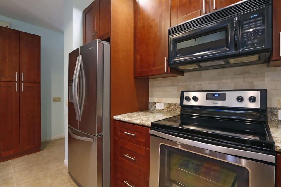 New stainless steel range and refrigerator with french doors