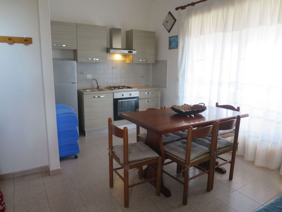 Furniture, Flooring, Floor, Interior Design, Chair, Kitchen & Dining Room Table, Table, Kitchen, Countertop, Kitchen Appliance
