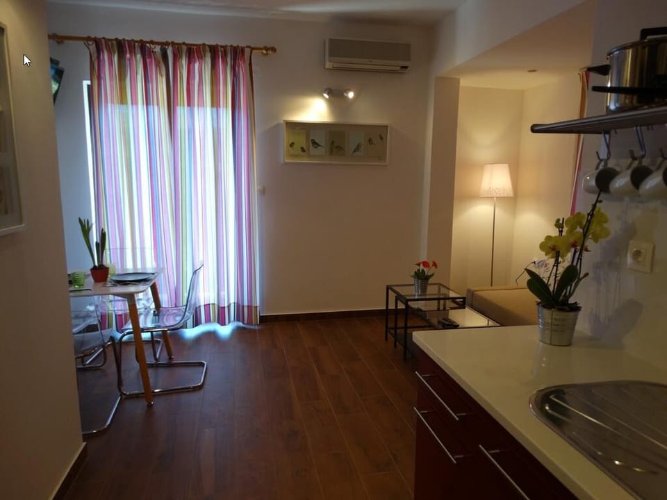 Apartment, 1 Bedroom | Living area | Flat-screen TV