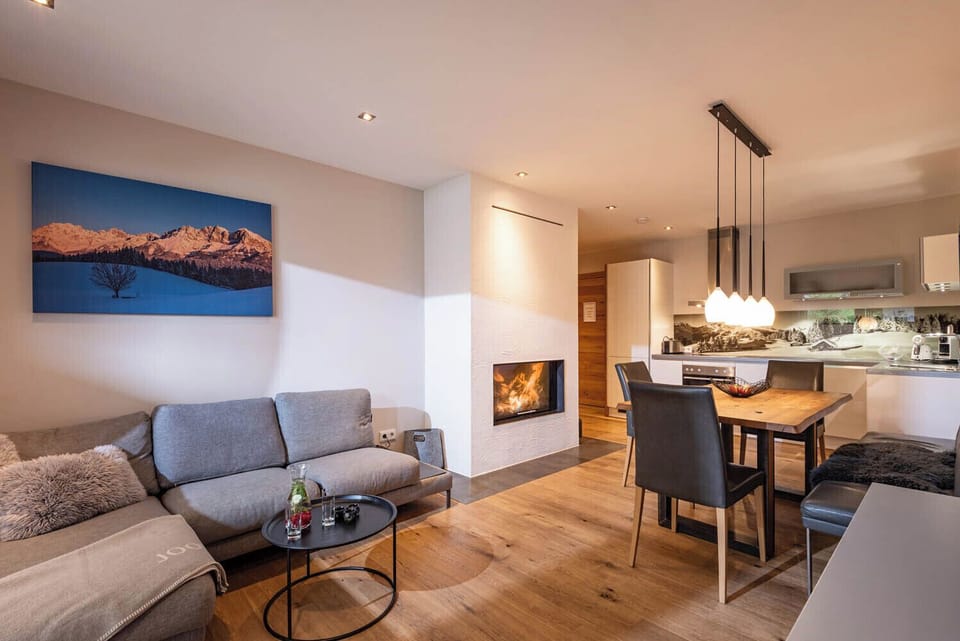 Deluxe Apartment, 2 Bedrooms, Mountain View | Living area | Flat-screen TV, fireplace, heated floors