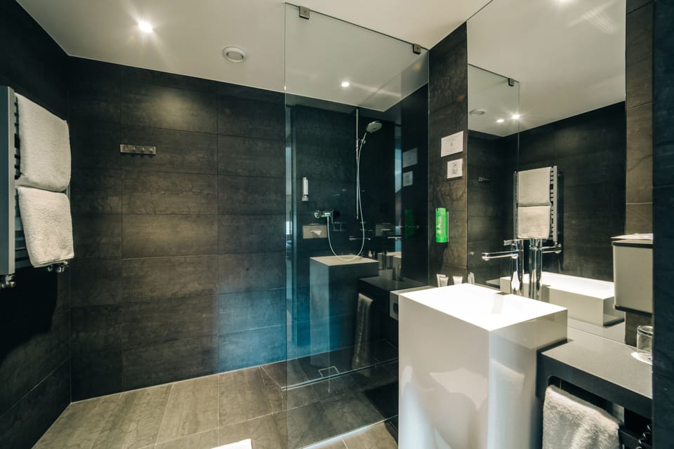Shower, rainfall showerhead, designer toiletries, hair dryer