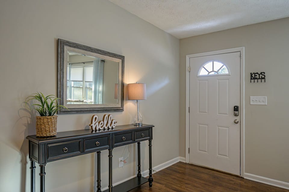 Interior view of the front entrance, home equipped with smartlock keypad.
