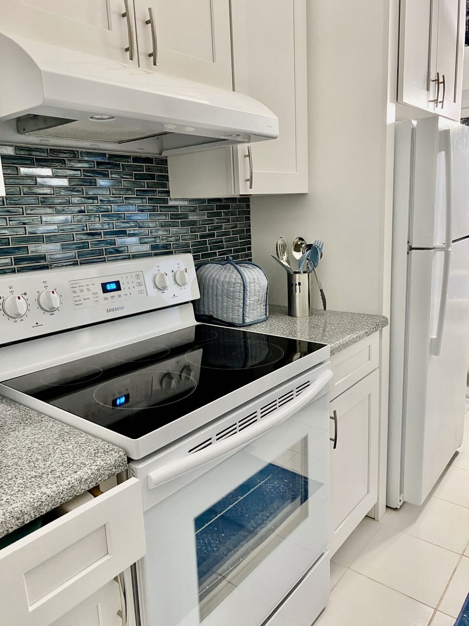 Full size oven, microwave, dishwasher, refrigerator, dishes, pots & pans.