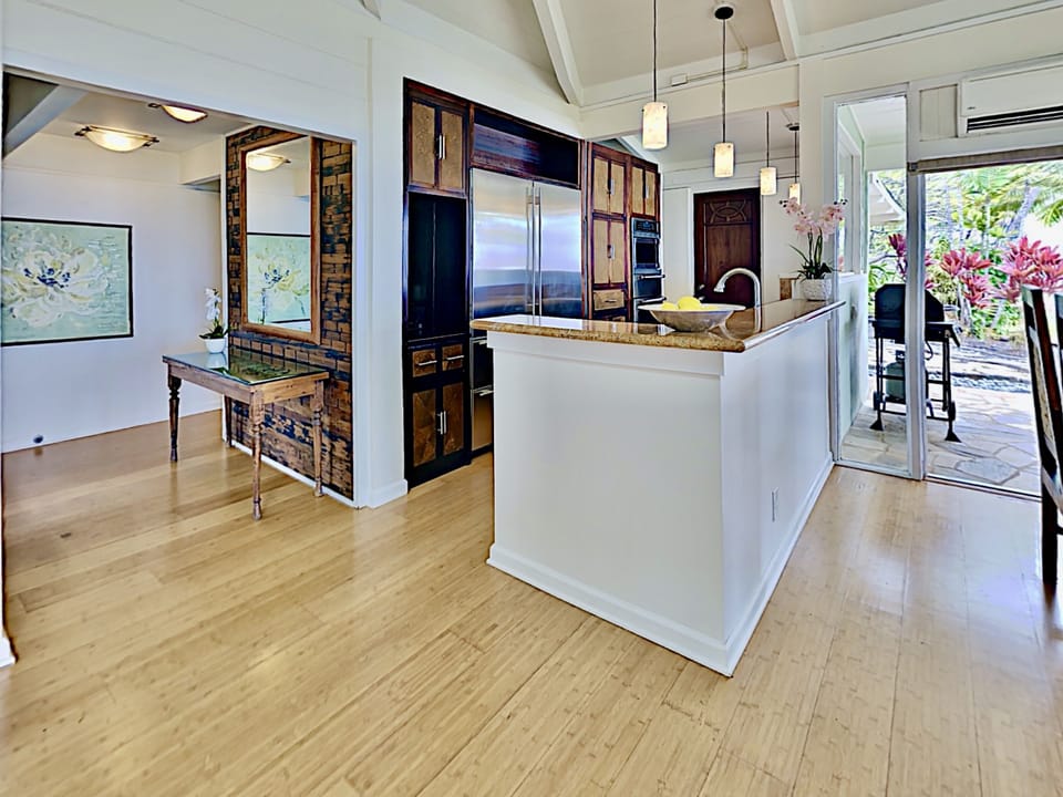 Kitchen - Skylights, windows and sliding doors let in the Maui sun!