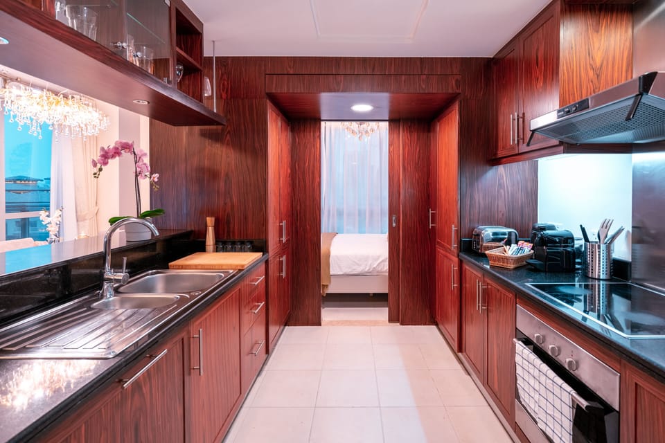 Apartment, 3 Bedrooms | Private kitchen | Full-size fridge, microwave, oven, stovetop