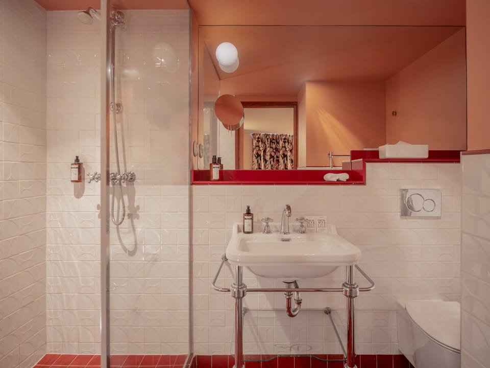 Eco-friendly toiletries, hair dryer, slippers, towels