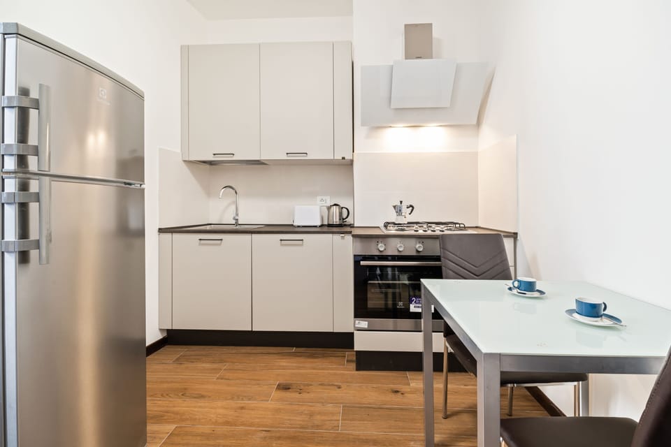 Apartment, 3 Bedrooms | Private kitchen | Full-size fridge, oven, stovetop, cookware/dishes/utensils