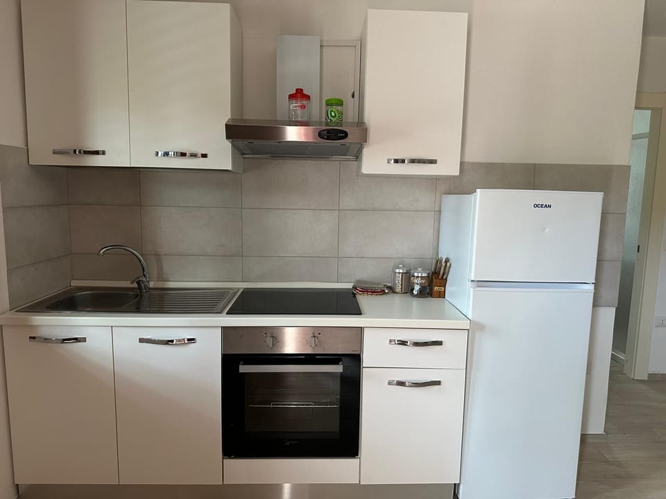 Apartment, 3 Bedrooms | Private kitchen | Full-size fridge, oven, stovetop, cookware/dishes/utensils