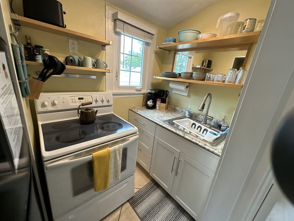 Full Kitchen with stove fridge with freezer and sink