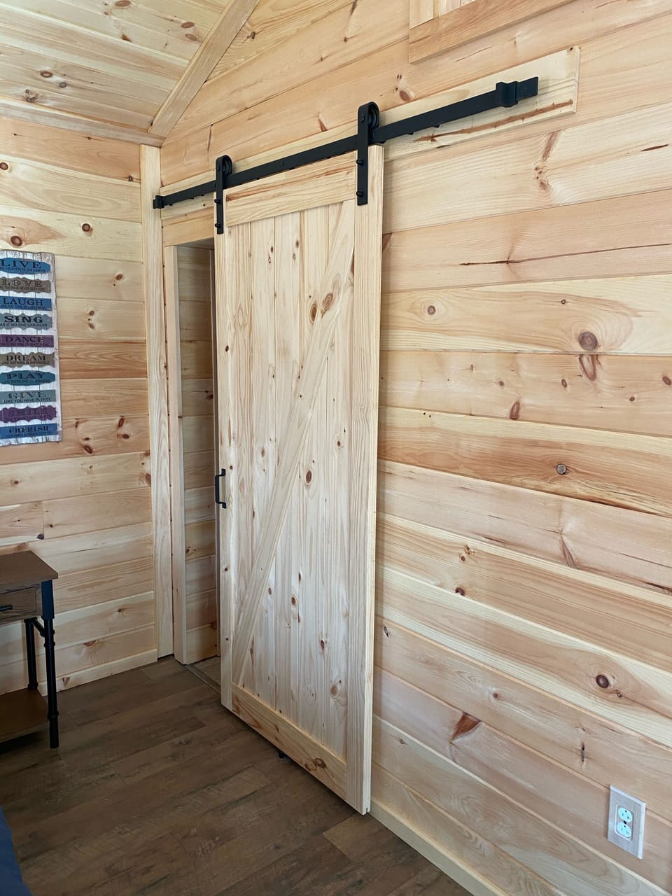 Sliding barn door on bath entrance.