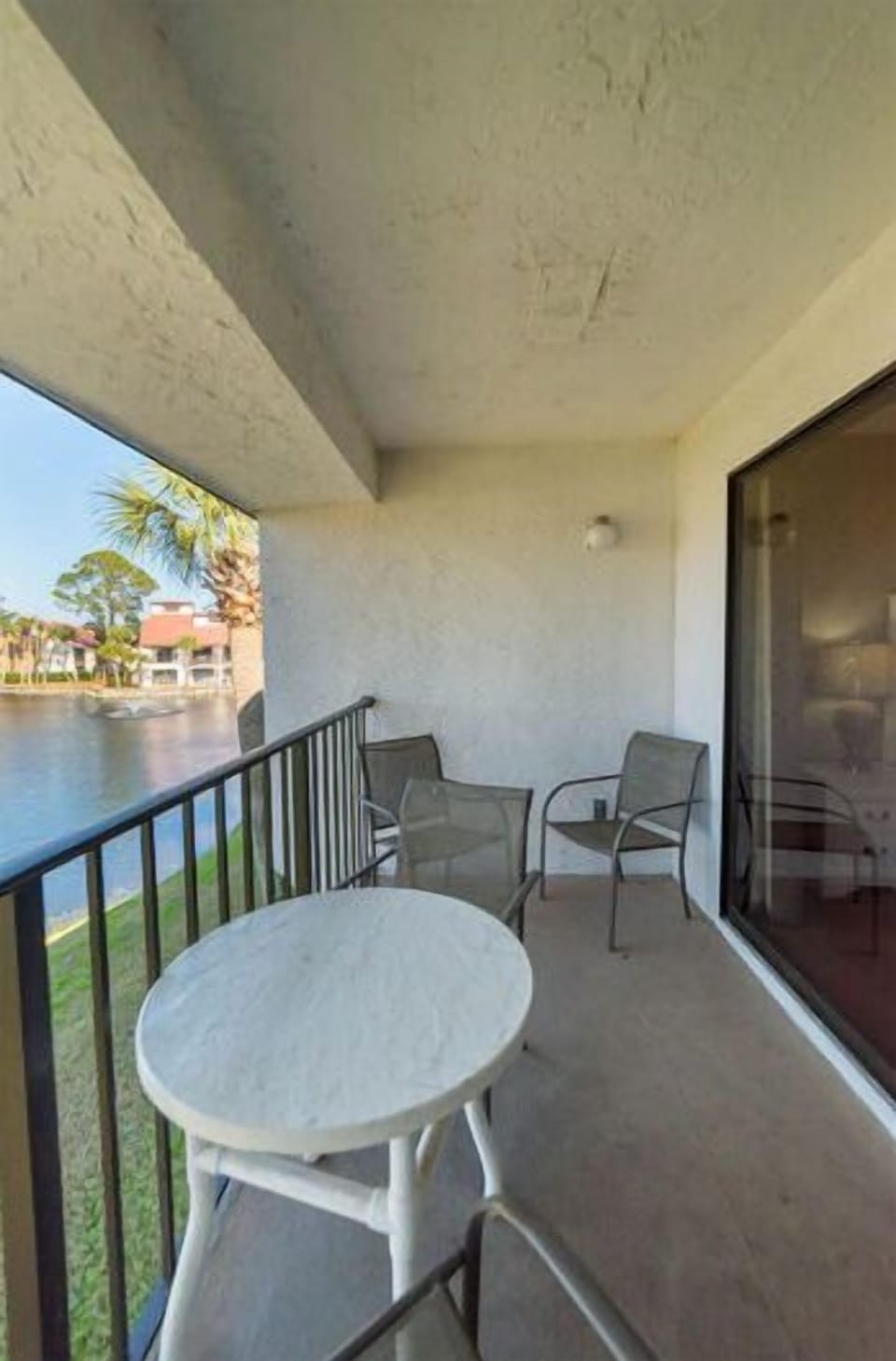 Enjoy coffee on the ultra private covered balcony with a lovely view of the golf course and one of the many ponds.