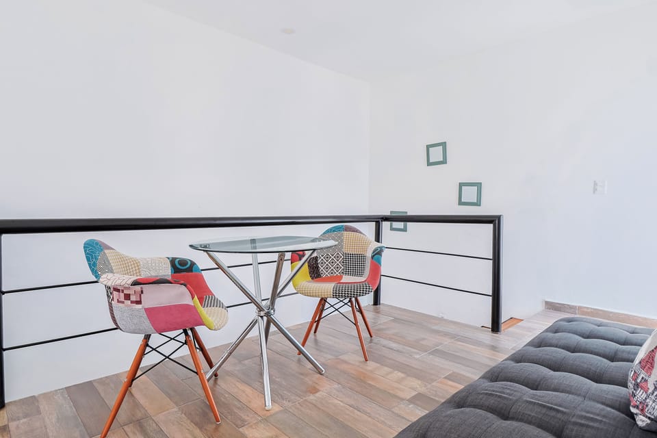 Deluxe Suite | Living area | 50-inch TV with digital channels, streaming services