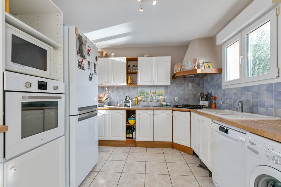 Villa | Private kitchen | Fridge, electric kettle, toaster, highchair