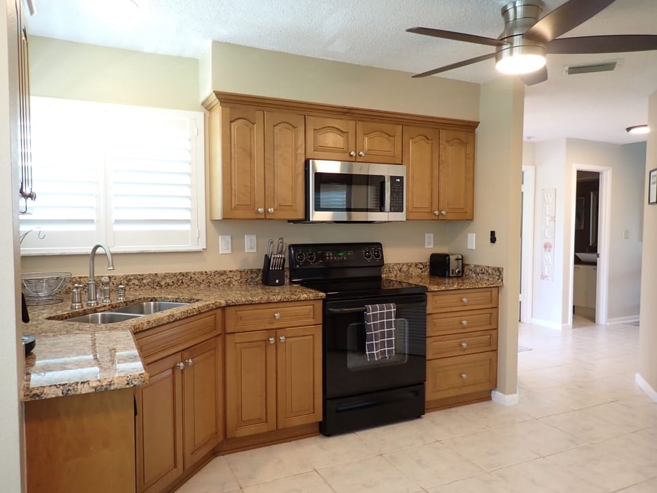 Kitchen equipped with Keruig and drip coffee maker (basket filter required). 

