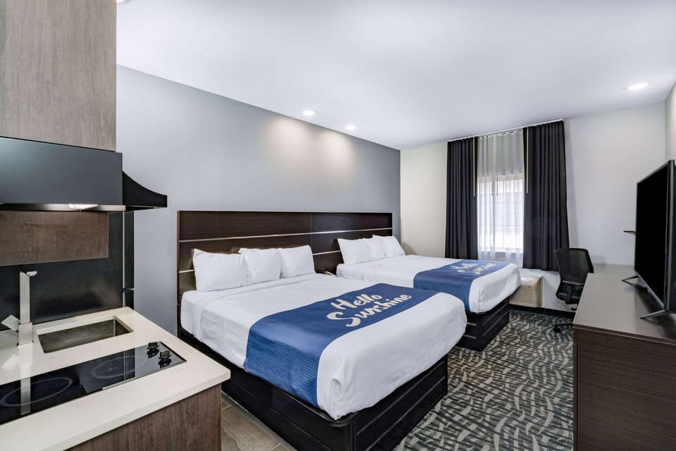 Room, 2 Queen Beds, Non Smoking (Kitchenette) | Desk, laptop workspace, iron/ironing board, free cribs/infant beds