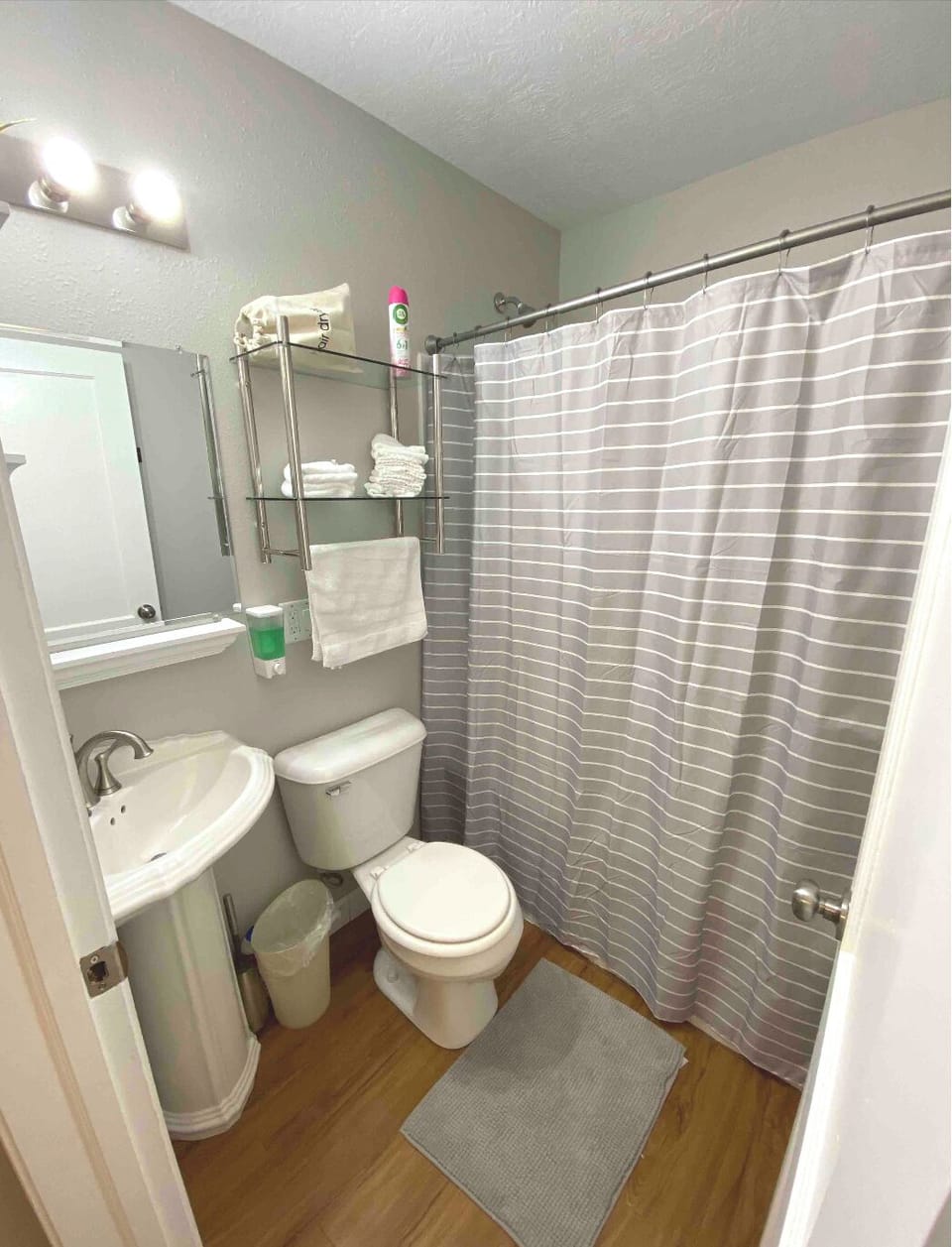 The bathroom is also equipped with a hairdryer and bath towels. 