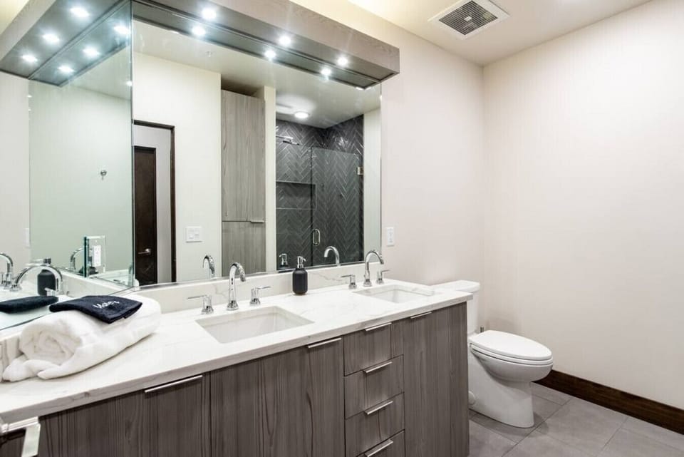 Master bathroom with large mirror