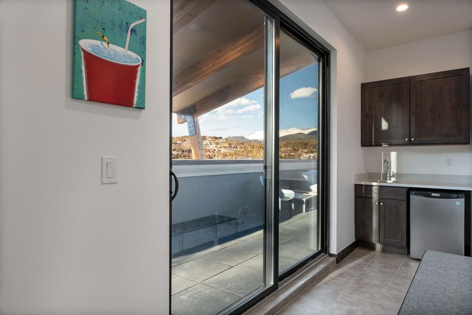 Top level wet bar and entrance to the rooftop patio