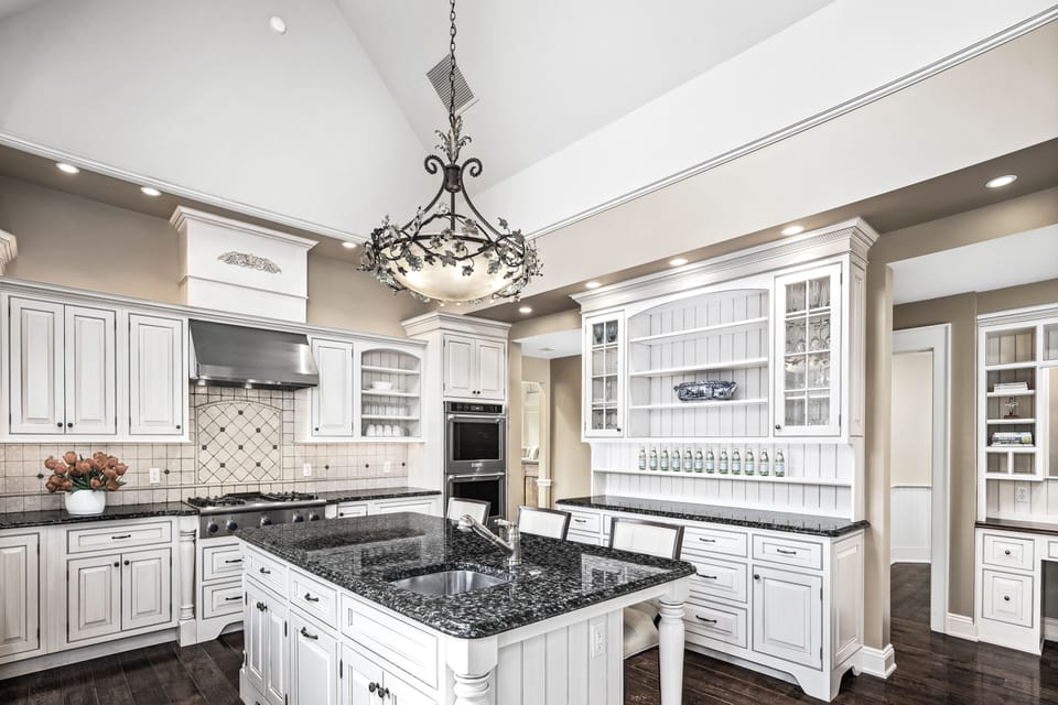 Kitchen seats 9 w/ vaulted ceilings, skylights, and adjoining breakfast nook