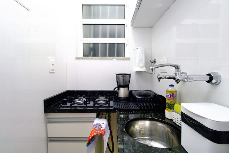 Basic Apartment | Private kitchen | Stovetop, electric kettle, toaster, cookware/dishes/utensils