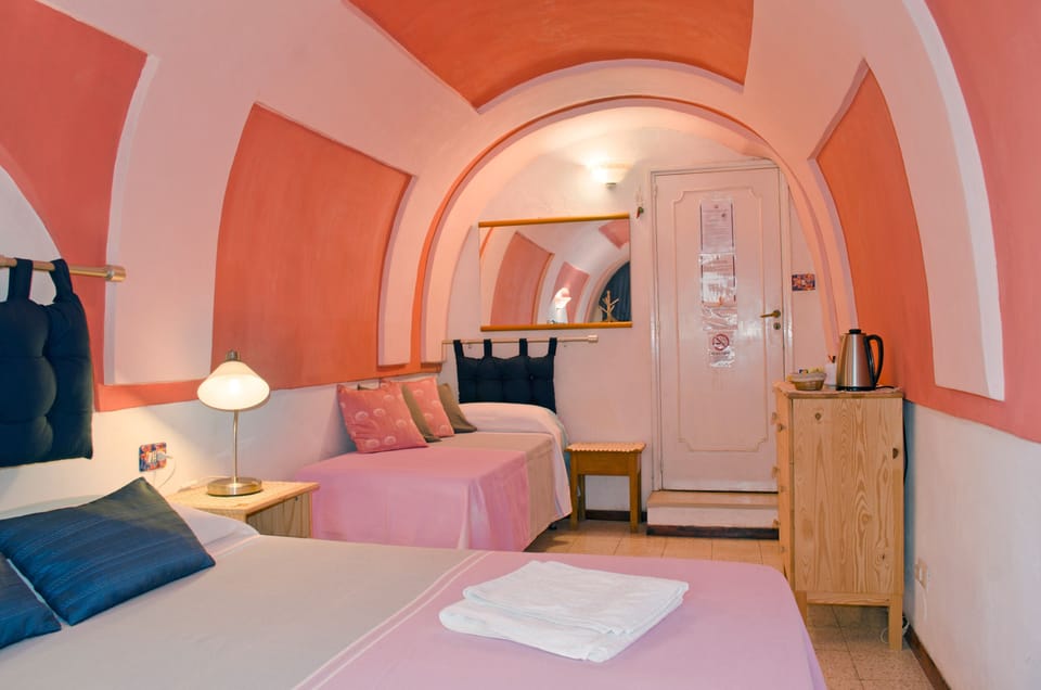 Economy Double Room (External Private Bathroom) | Minibar, in-room safe, desk, blackout drapes