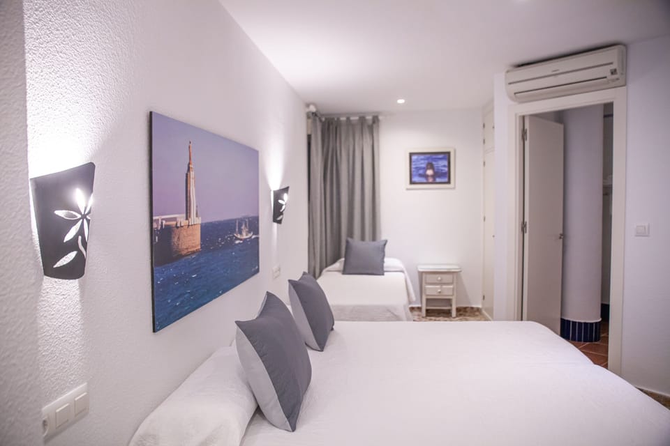 Standard Triple Room, Private Bathroom | Desk, iron/ironing board (on request), WiFi (free), bed sheets