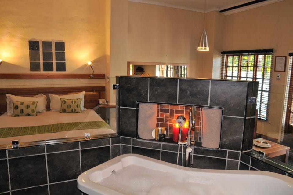 Deluxe Double Room | Bathroom | Combined shower/tub, deep soaking tub, free toiletries, hair dryer
