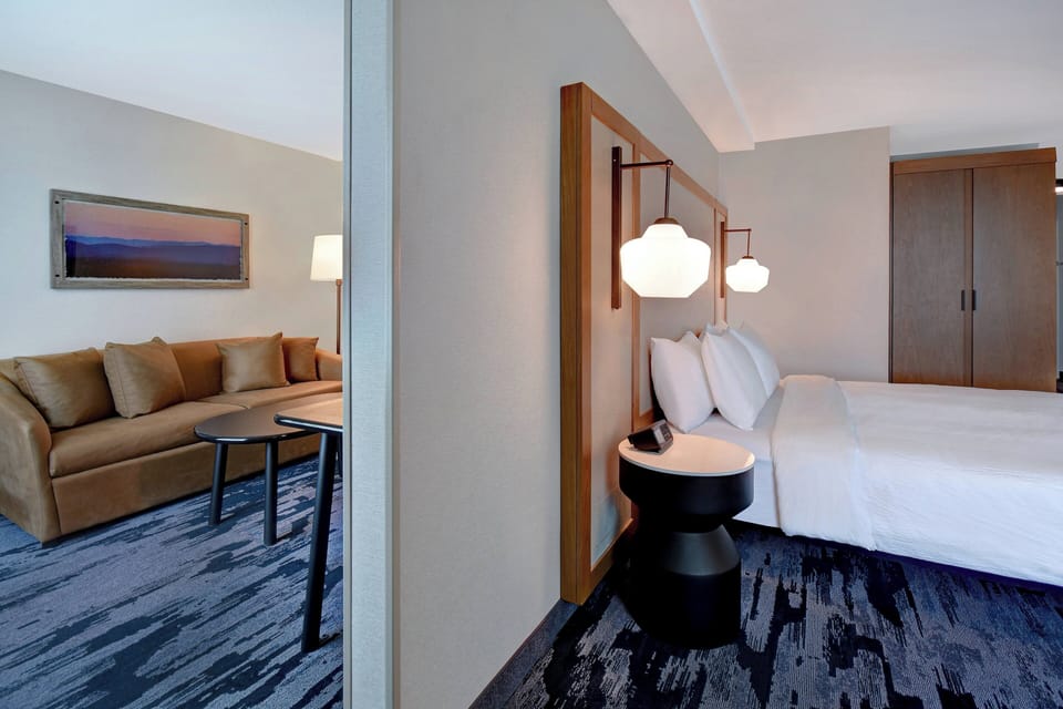 Suite, 1 King Bed with Sofa bed, Corner | Blackout drapes, iron/ironing board, free WiFi, bed sheets