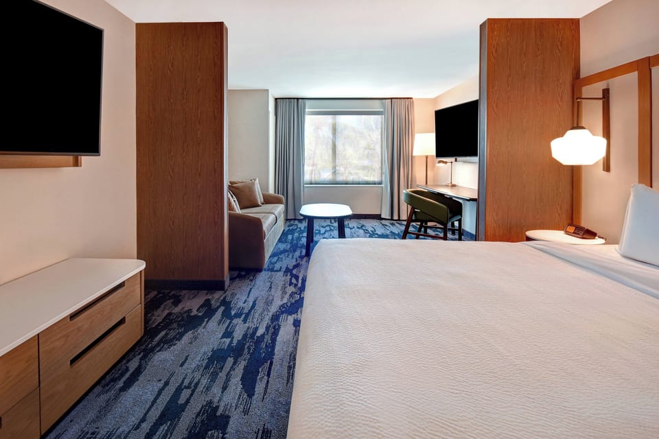 Suite, 1 King Bed with Sofa bed | Blackout drapes, iron/ironing board, free WiFi, bed sheets