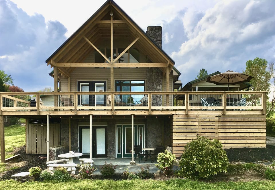 Covered Rear porch looking over the lake. 