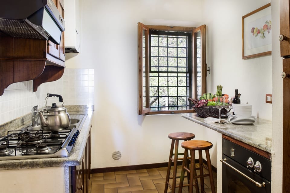 Apartment, 2 Bedrooms (Il Focolare) | Private kitchen | Full-size fridge, electric kettle, highchair, freezer