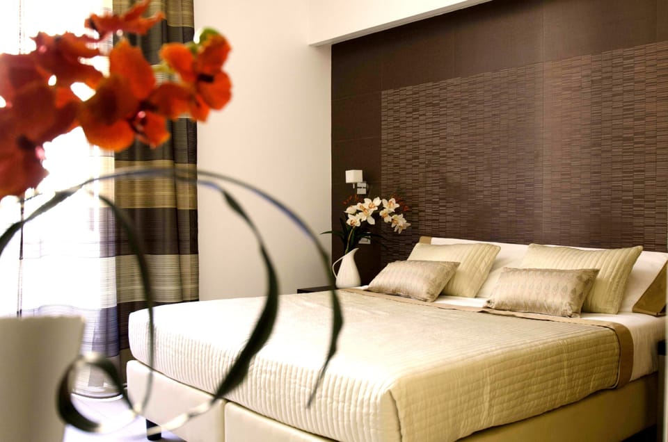Deluxe Triple Room, Private Bathroom | Premium bedding, down comforters, in-room safe, individually decorated