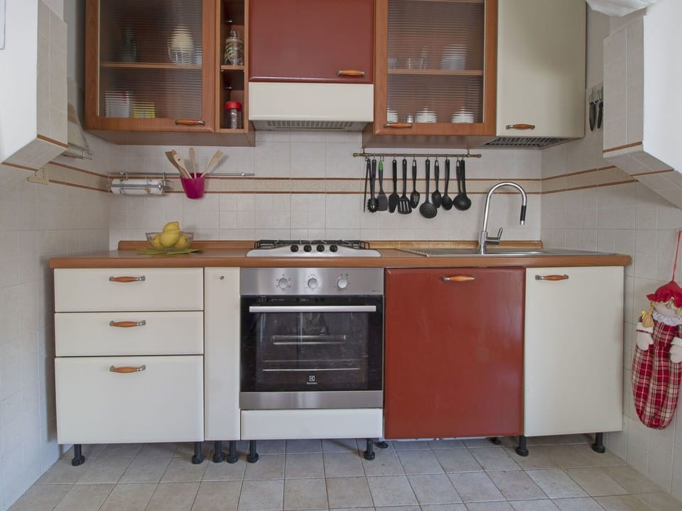 Cabinetry, Kitchen, Furniture, Room, Countertop, Property, Kitchen Stove, Major Appliance, Interior Design, Tile