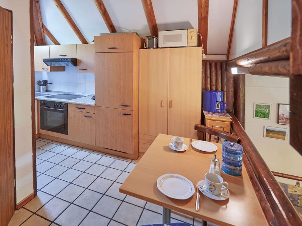 Table, Property, Furniture, Cabinetry, Tableware, Wood, Interior Design, Refrigerator, Flooring, Building