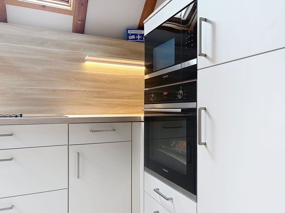 Flooring, Wood, Floor, Interior Design, Cabinetry, Countertop, Kitchen Appliance, Furniture, Kitchen, Home
