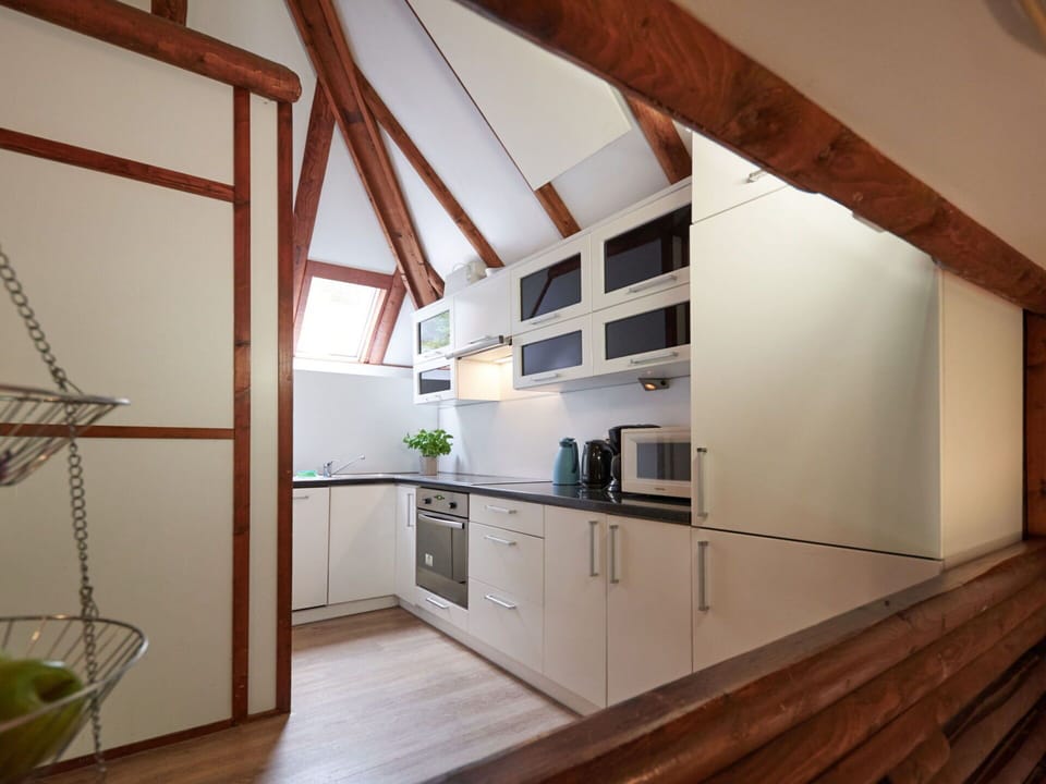 Cabinetry, Countertop, Wood, Lighting, Kitchen, Flooring, Floor, Wood Stain, Hardwood, Beam