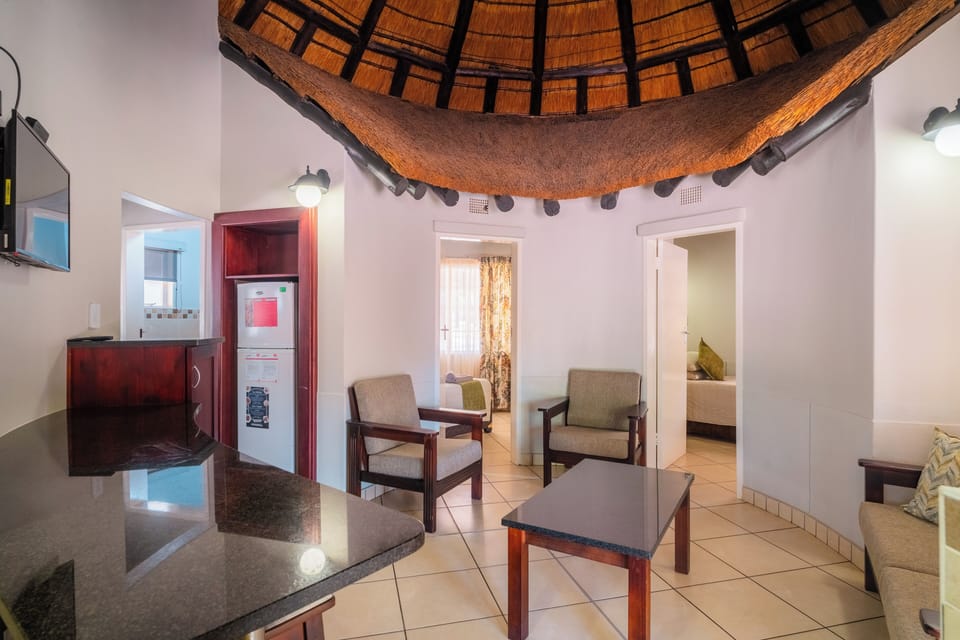 Bungalow, 2 Bedrooms | Living area | Flat-screen TV, foosball, table tennis, books