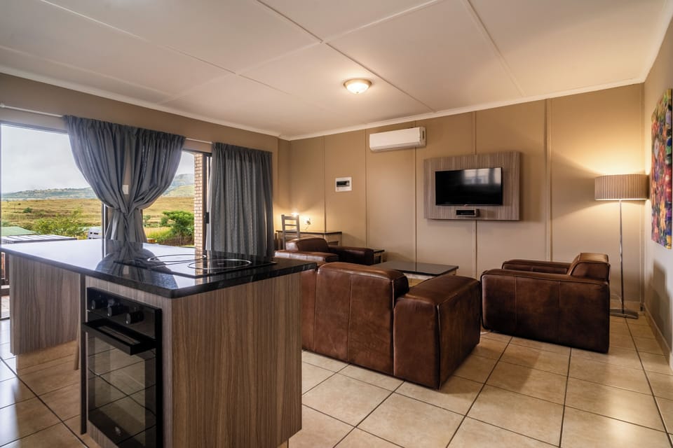 4 Sleeper Cottage | Living area | 32-inch flat-screen TV with satellite channels, TV, foosball