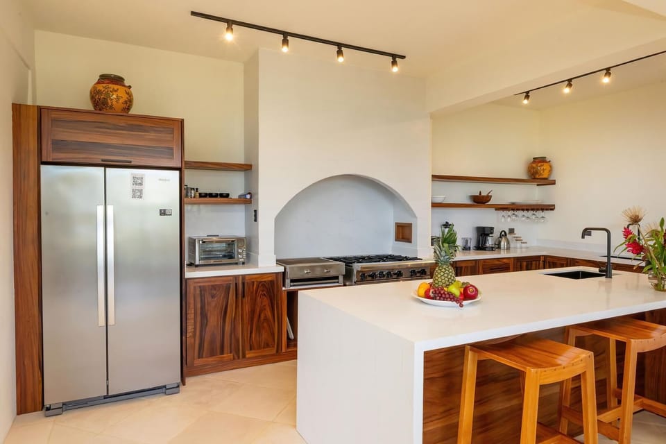 Thoughtfully designed kitchen with custom wood cabinetry and functional layout.