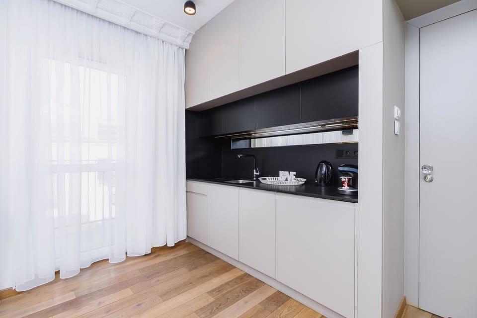 A small but functional kitchen setup with modern appliances and storage solutions.